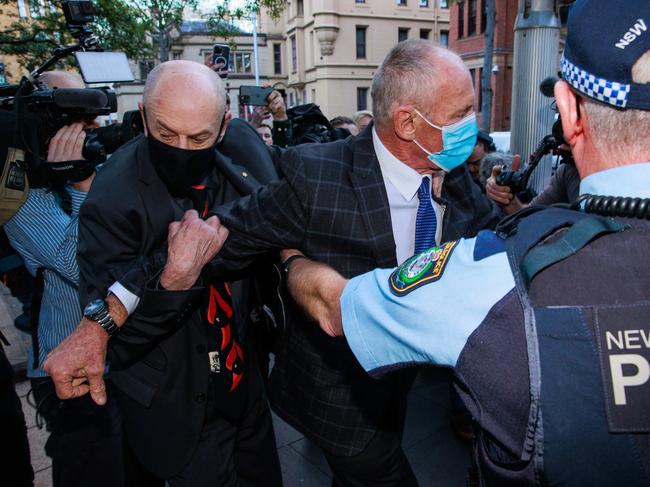 Peter and Paul Dawson with police after the verdict. Picture: Picture: Justin Lloyd.