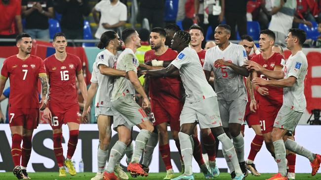 Granit Xhaka and Serbias players scuffle during the Group G clash at Stadium 974 in Doha. Picture: AFP