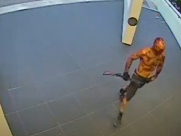 A blood soaked Ben Hoffmann outside NT Police's Peter McAulay Centre during his murderous shotgun rampage in June 2019.