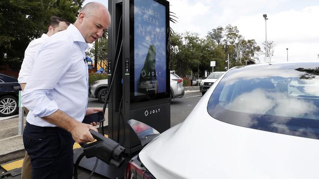 Former Treasurer and Minister for Energy Matt Kean plugging in his electric vehicle at the Park&amp;Ride car park in Narrabeen. Picture: Jonathan Ng