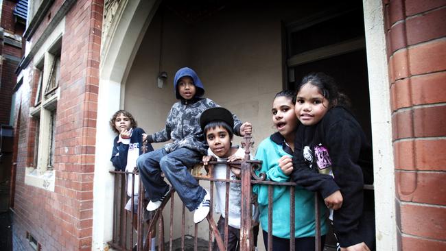 Local children (L-R) Anthony Blacklock, Benjamin Ceissman, Peter Williams, Christina Duckett and Kimberley Byers outside the St Vincent's Catholic Church in Redfern, Sydney.