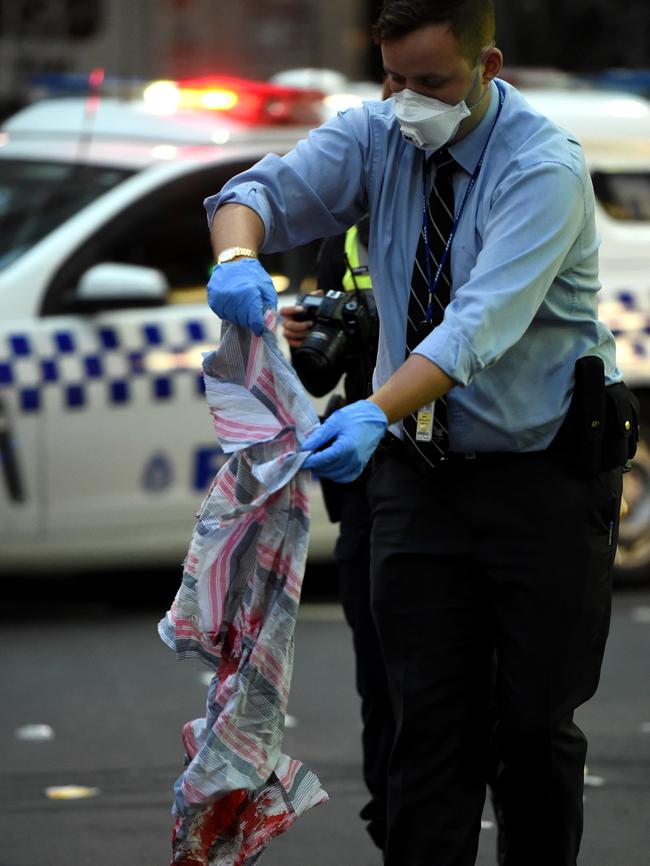 Police collecting evidence at the scene of the stabbing on Monday. Picture: Nicole Garmston