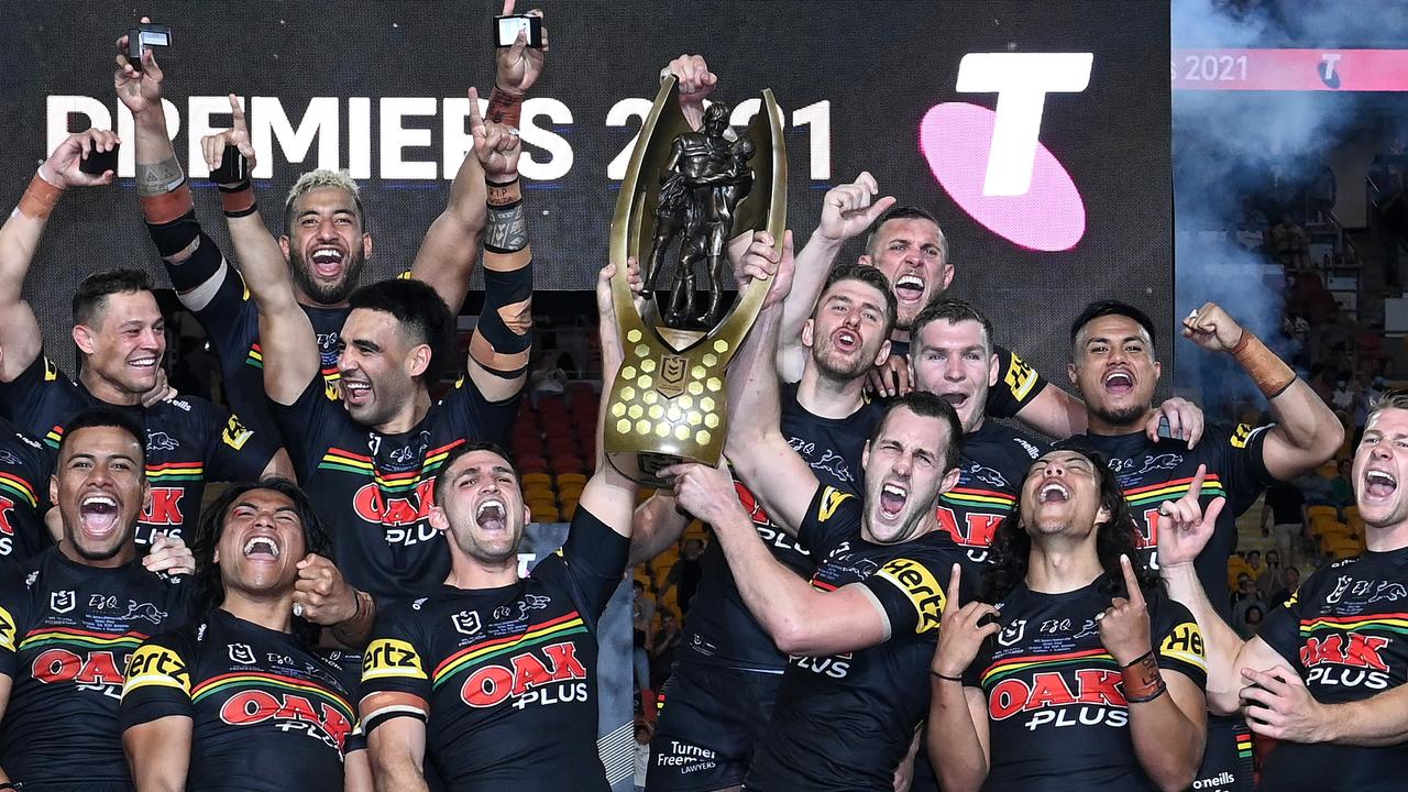 Nathan Cleary and Isaah Yeo hold aloft the Premiership Trophy after winning the 2021 NRL Grand Final. Photo by Bradley Kanaris/Getty Images.