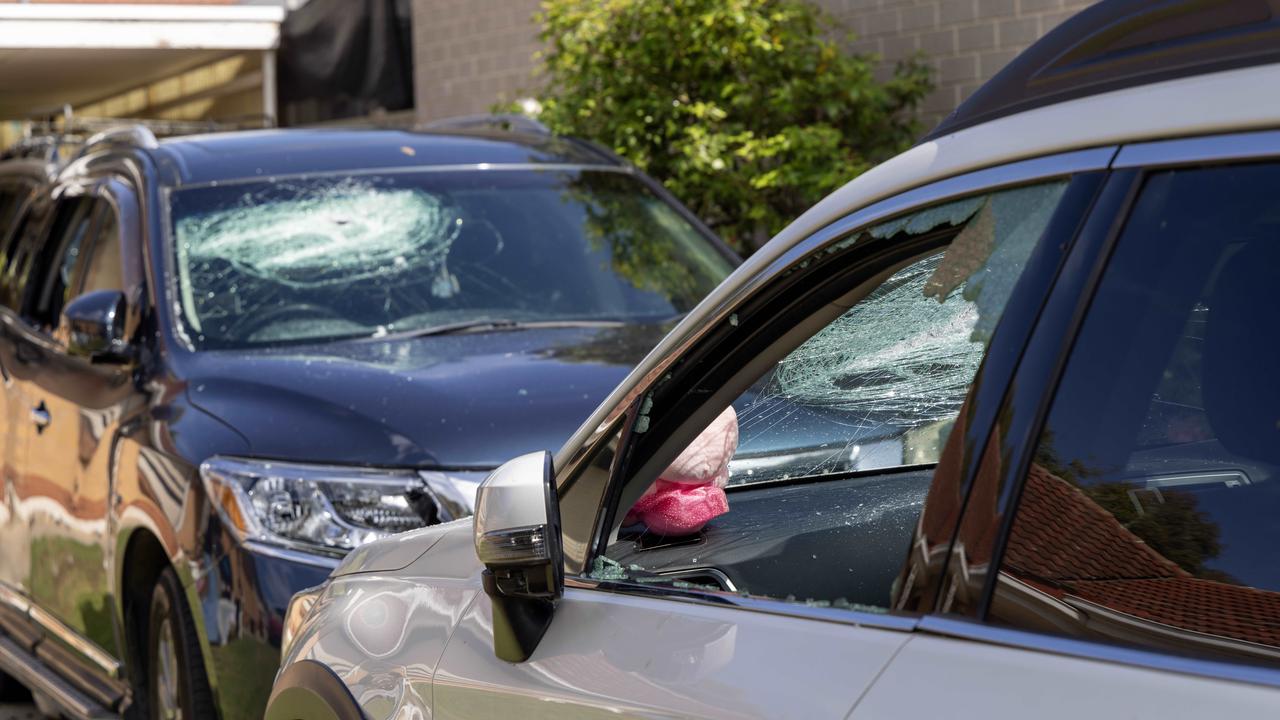 Damaged vehicles after machete-wielding men terrorised a home in Nelson St at Kilburn early on Sunday. Picture: Kelly Barnes