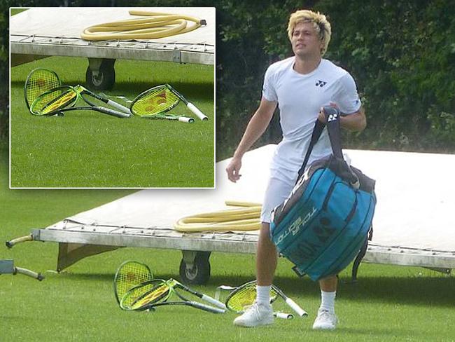 Australian tennis player Akira Santillan smashed five racquets in an epic meltdown after his Wimbledon qualifying loss. Picture: Twitter/Ricky Dimon @Dimonator