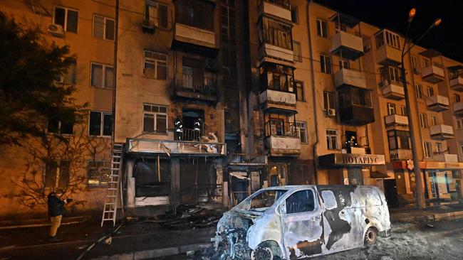 Ukrainian rescuers work on a residential building after a drone strike on Kharkiv late on May 2. Picture: AFP