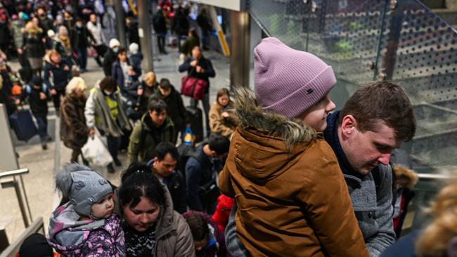 People who fled the war in Ukraine walk towards a humanitarian train which is relocating refugees to Berlin on March 18, 2022 in Krakow, Poland. Picture: Omar Marques/Getty Images