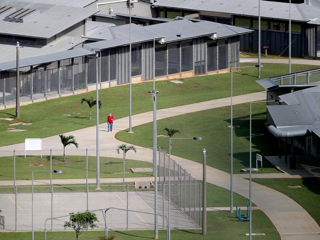 An evacuee is seen walking in the Christmas Island Australian Immigration Detention Centre on Wednesday, February 5, 2020. Evacuees, who arrived from China's Wuhan city, the epicentre of the coronavirus, are quarantined at the Detention Centre on Christmas Island, about 1,400 km northwest of mainland Australia. (AAP Image/Richard Wainwright) NO ARCHIVING