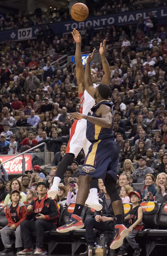 Toronto Raptors' Demar DeRozan, top, attempts but misses a last-second basket.
