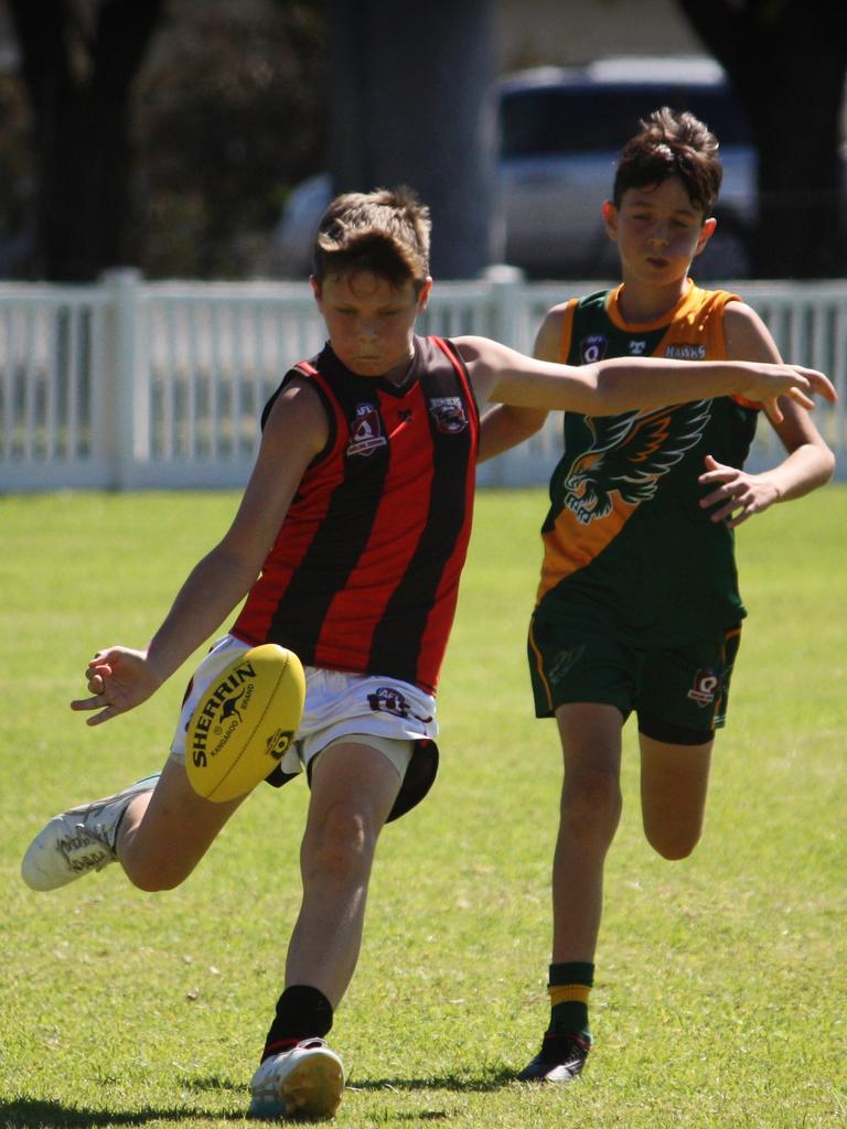 Charles Barwick kicks for South Toowoomba Bombers.