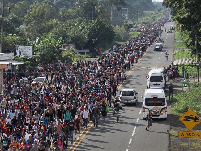 CIUDAD HIDALGO, MEXICO - OCTOBER 21:  A migrant caravan walks into the interior of Mexico after crossing the Guatemalan border on October 21, 2018 near Ciudad Hidalgo, Mexico The caravan of Central Americans plans to eventually reach the United States. U.S. President Donald Trump has threatened to cancel the recent trade deal with Mexico and withhold aid to Central American countries if the caravan isn't stopped before reaching the U.S.  (Photo by John Moore/Getty Images)