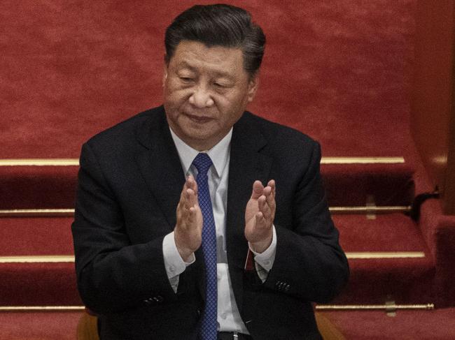 BEIJING, CHINA - MAY 28: Chinese president Xi Jinping, applauds the results of a vote on a new draft security bill for Hong Kong during the closing session of the National People's Congress on May 28, 2020 in Beijing, China. The Chinese government passed the draft by a vote of 2,878 votes to one during the session. The draft law, which has drawn international concern, is set to address issues such as secession, subversion, terrorism, and foreign interference, and comes after a year of anti-government protests in the semi-autonomous region. China held its annual parliamentary gathering, known as 'The Two Sessions', at the Great Hall of the People from May 21-28th after being postponed at the height of the coronavirus outbreak in China earlier this year. (Photo by Kevin Frayer/Getty Images)