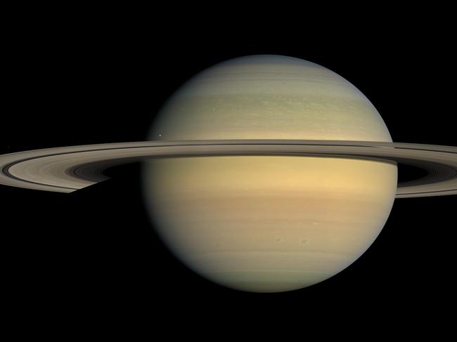 FILE - This July 23, 2008 file image made available by NASA shows the planet Saturn, as seen from the Cassini spacecraft. Twenty new moons have been found around Saturn, giving the ringed planet a total of 82, scientists said Monday, Oct. 7, 2019.   (NASA/JPL/Space Science Institute via AP, File)