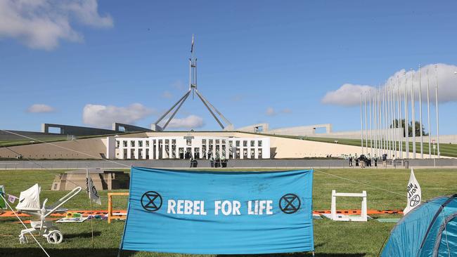 Climate change protesters set up tents on the lawns of Parliament House in Canberra. Picture: NCA NewsWire / Gary Ramage