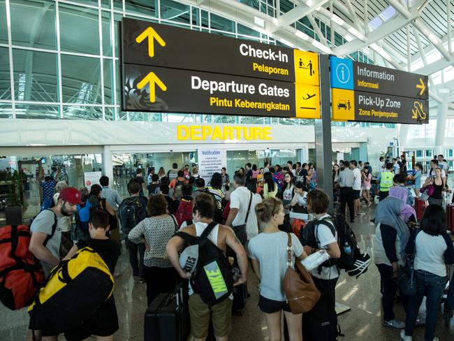 DENPASAR, BALI, INDONESIA - JULY 13: Foreign tourists arrive at Ngurah Rai International airport departure on July 13, 2015 in Denpasar, Bali, Indonesia. Bali's international airport reopened after being closed due to volcanic ash clouds from Maunt Raung, but Australia's main carriers to the holiday destinations are still not flying. (Photo by Agung Parameswara/Getty Images)