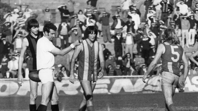 Field umpire Robin Bennet  admonishes footballer John Cassin during the controversial West Torrens vs West Adelaide match in 1975.