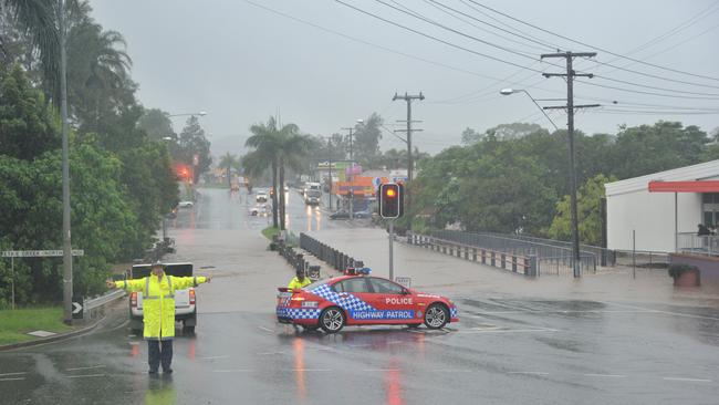 Bridge over Petrie Creek at Currie Street goes under in January 2011. Photo: Brett Wortman / Sunshine Coast Daily