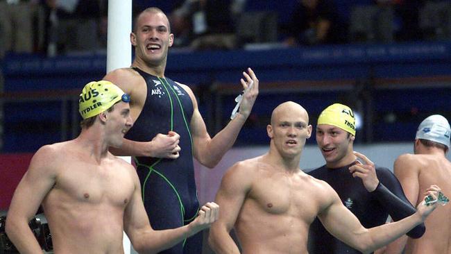 Sydney Olympics 2000 - Swimming - swimmer (l-r) Australia's Chris Fydler, Ashley Callus, Michael Klim and Ian Thorpe play air guitar after victory in Sydney 2000 Olympic Games 4x100 relay final at Homebush 16 Sep 2000.