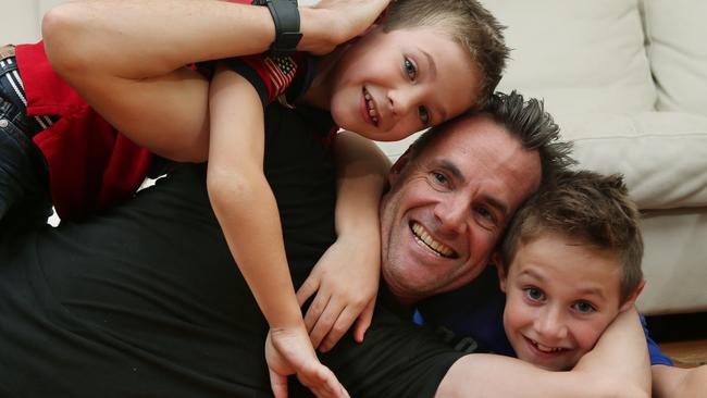 Dad Justin Phillips and his boys Luke and Toby. Picture: David Crosling