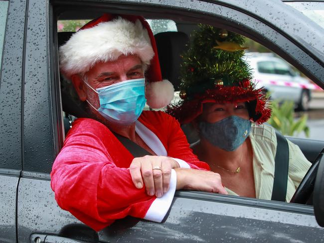 Santa and his helper, Nigel Berridge and Sarah Le-Hanie, from Avalon, getting tested on Christmas Day at Avalon Covid 19 testing station.Picture:Justin Lloyd.