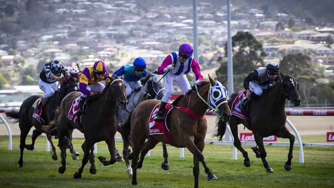 Toorak Affair (centre) ridden by Anthony Darmanin trained by Michael Trinder wins the 2020 Hobart Cup. Picture: LUKE BOWDEN