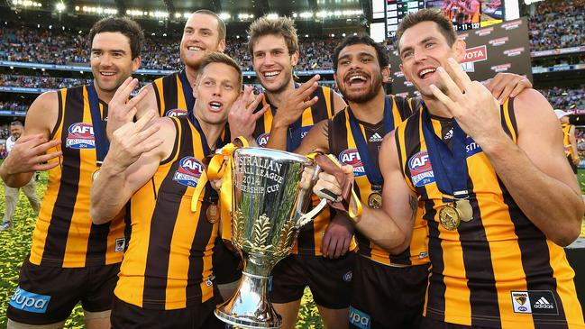 Jordan Lewis, Jarryd Roughead, Sam Mitchell, Grant Birchall, Cyril Rioli and Luke Hodge of the Hawks celebrate with the Premiership Cup after the 2014 AFL Grand Final victory against the Sydney Swans. Picture: Quinn Rooney