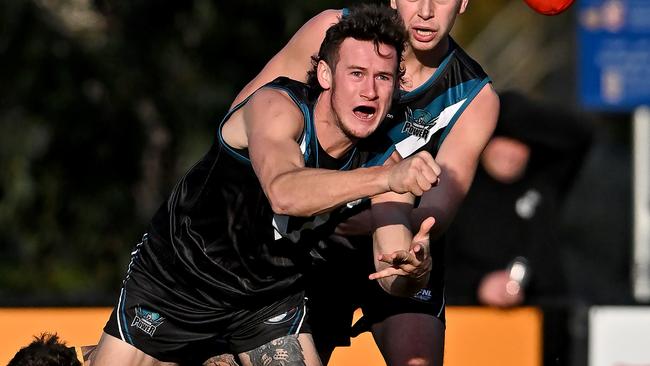 Laurimar’s Jake Richards fires out a handball. Picture: Andy Brownbill