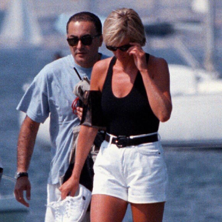 The pair walk along pontoon in St Tropez in Southern France.