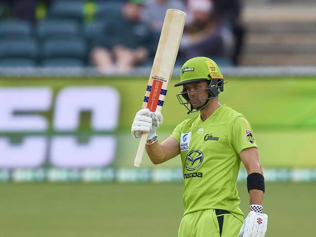 Callum Ferguson of the Thunder celebrates after scoring a half century.