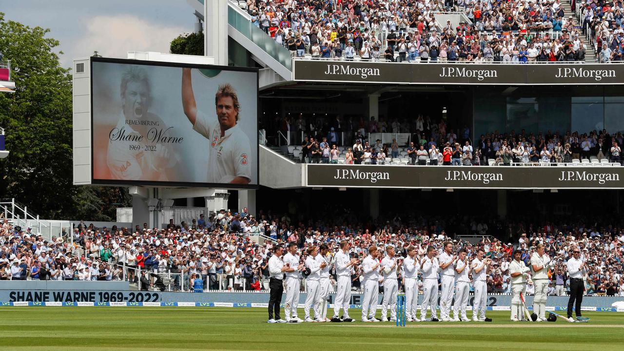 Spectators and players take a moment at the end of the 23rd over to applaud for 23 seconds to commemorate Shane Warne. Picture: AFP