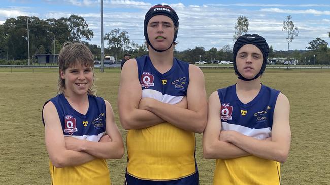 Coolum State High junior boys players Billy Clements, Zakai Lennox-Smith and Kaius Filder-Sullivan relax after a hard match.
