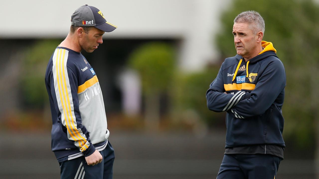 MELBOURNE, AUSTRALIA - SEPTEMBER 17: Alastair Clarkson, Senior Coach of the Hawks (left) and Chris Fagan, Football Manager of the Hawks share a discussion during the Hawthorn Hawks training session at the Ricoh Centre, Melbourne on September 17, 2015. (Photo: Michael Willson/AFL Media)