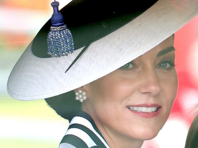 LONDON, ENGLAND - JUNE 15: Catherine, Princess of Wales smiles as she travels by carriage during Trooping the Colour at Buckingham Palace on June 15, 2024 in London, England. Trooping the Colour is a ceremonial parade celebrating the official birthday of the British Monarch. The event features over 1,400 soldiers and officers, accompanied by 200 horses. More than 400 musicians from ten different bands and Corps of Drums march and perform in perfect harmony. (Photo by Chris Jackson/Getty Images)