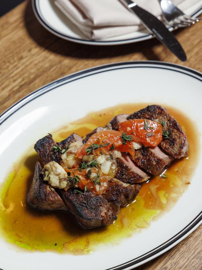 Steak with smoked tomato and bone marrow at Oliveti restaurant, Glenelg South