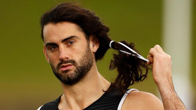 Brodie Grundy of the Magpies adjusts his hair during a Collingwood training session at Henson Park in Sydney. Picture: Ryan Pierse/Getty Images