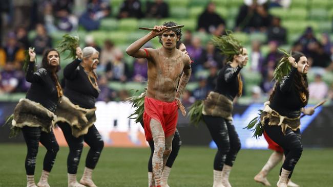 Indigenous dancers perform during a Welcome to Country before the round 15, 2023. Photo by Daniel Pockett/Getty Images