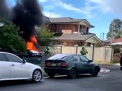 The silver Lexus police believe was used by the gunmen was found burning in a nearby street..