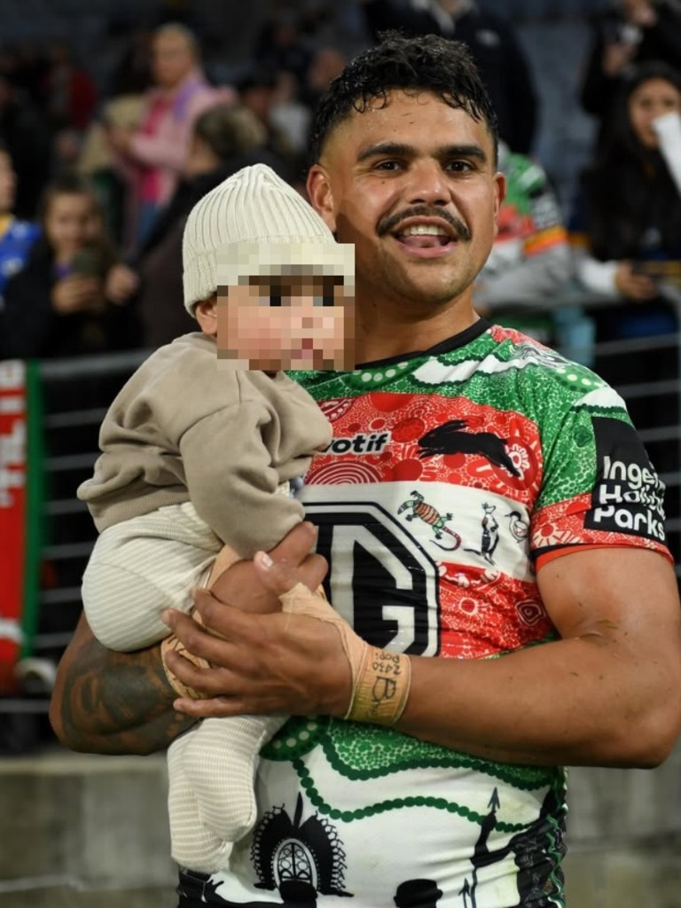 Latrell Mitchell holding his child. Photo: Instagram, @trellmit.