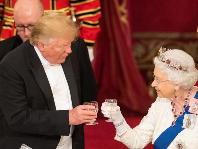 US President Donald Trump and the Queen make a toast during the lavish state banquet at Buckingham Palace. Picture: Getty