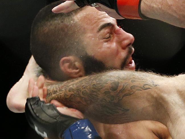 Donald Cerrone lands a kick to John Makdessi that ended the lightweight mixed martial arts bout at UFC 187 on Saturday, May 23, 2015, in Las Vegas. (AP Photo/John Locher)