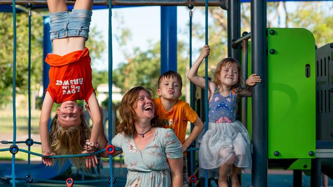 Amy Milford with three of her four kids – Maddy, 10, Oliver, 8, and Violet, 4 – at Anula Park Playground. Picture: Che Chorley