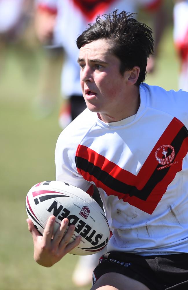 Boys Rugby League State Championship held at Northern Division, Brothers Leagues ground, Townsville. South West (black) v Wide Bay (white). 16-18 years. Ezekiel Monckton of Shalom College.