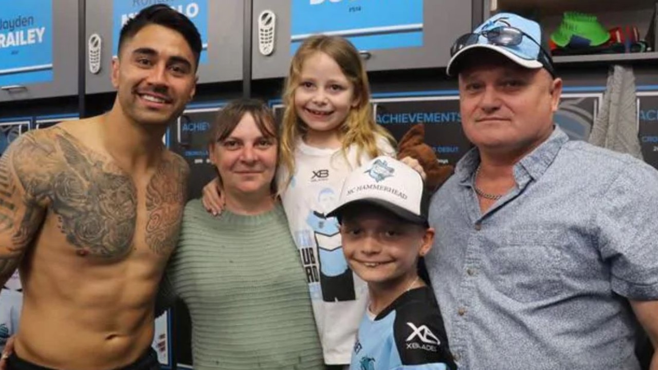 Jason, mother Sharon, father Greg and sister Lara in the sheds last year.