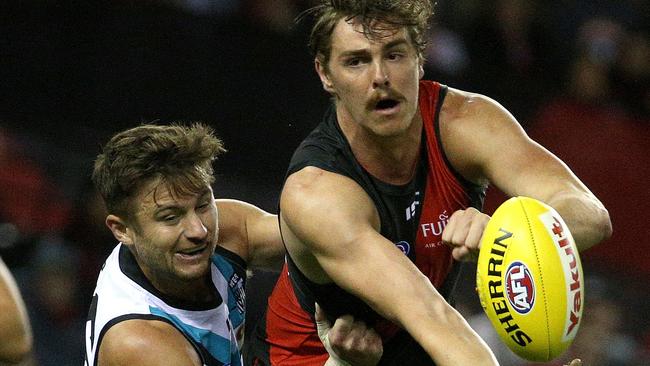 Sam Gray applies pressure to Joe Daniher. Picture: AAP Image/Hamish Blair