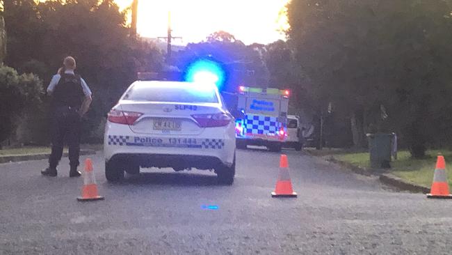 Police block the road at the scene of a multiple stabbing incident at Goonellabah.