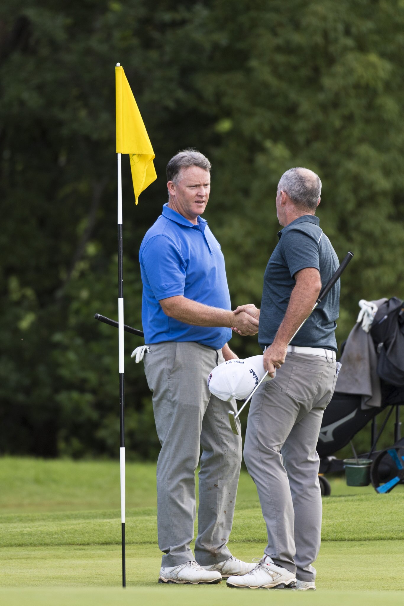 Marcus Fraser (left) and Matthew Millar shake hands at the conclusion of round two of the Queensland PGA Championship at City Golf Club, Friday, February 14, 2020. Picture: Kevin Farmer