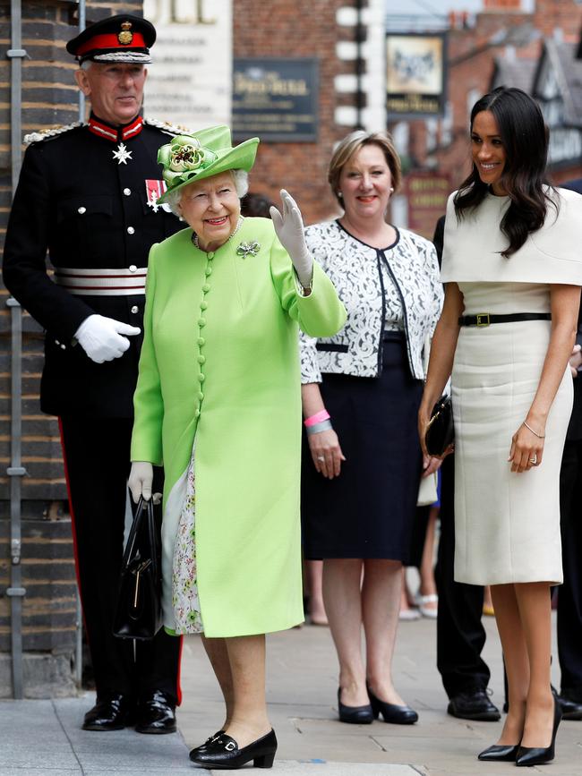 Queen Elizabeth II waves during a June, 2018 engagement with Meghan, Duchess of Sussex. Picture: Getty Images