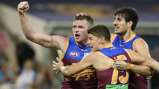 Pearce Hanley, Dayne Zorko and Sam Mayes celebrate a goal. Picture: Jono Searle