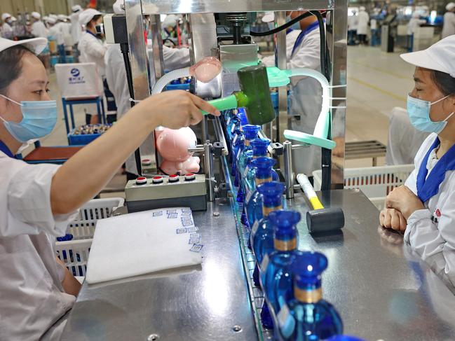 Workers at a liquor factory in Suqian in China's eastern Jiangsu province. Picture: AFP