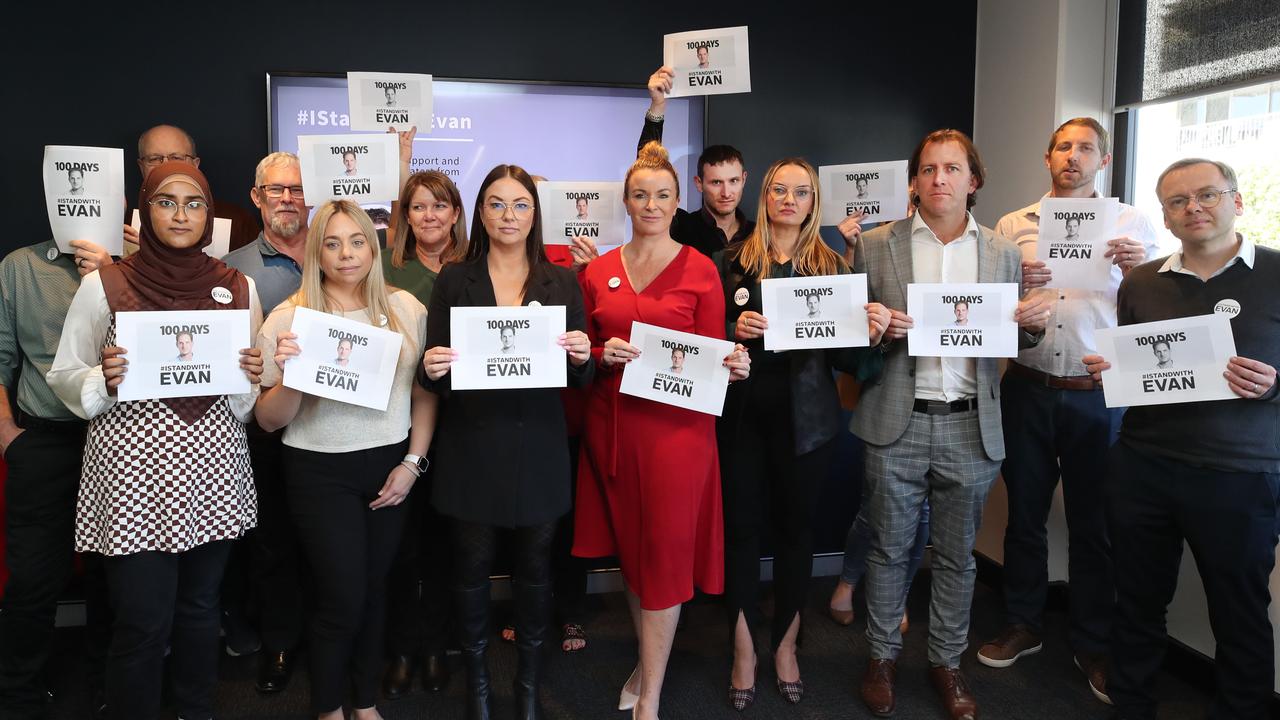 Gold Coast Bulletin staff stand with Evan. Picture: Glenn Hampson